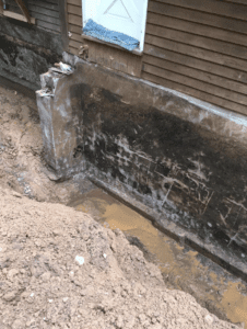 before waterproofing a basement